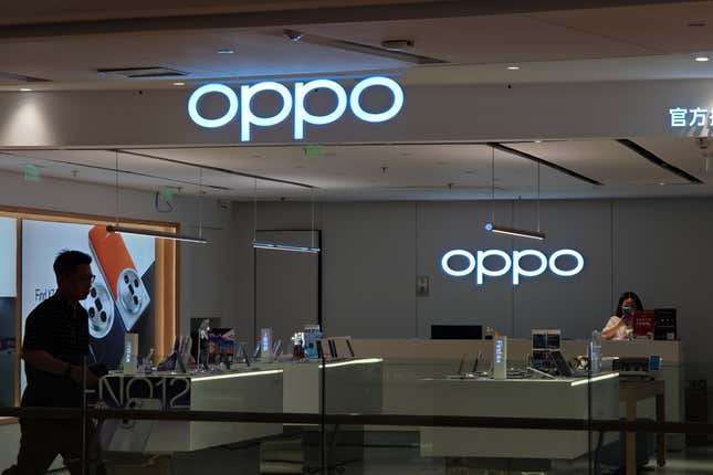 Customers are walking past an OPPO authorized experience store