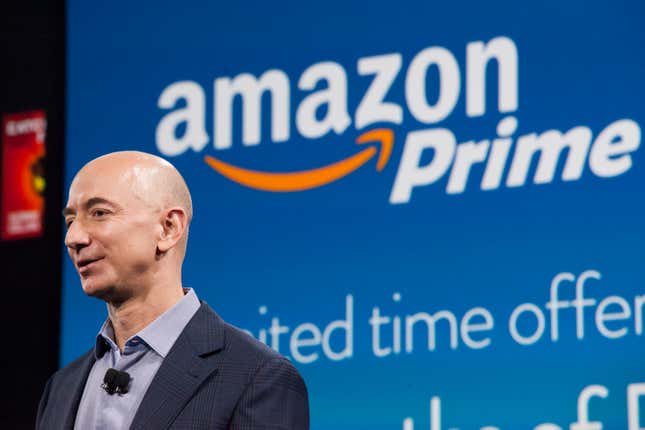 jeff bezos speaking in front of an amazon prime logo